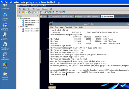 A VMware Workstation hosting a Windows Server 2008 machine, a Windows Server 2003 machine and a Red Hat Fedora client..